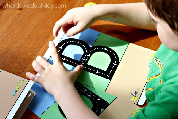 Learning letter formation with alphabet cards.