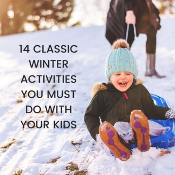 Smiling child on sled in snow with text overlay that reads, 14 classic winter activities you must do with your kids.