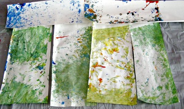 Several splatter art papers from shaken container art.