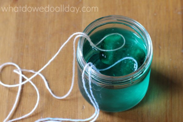 ice cube science experiment with salt and string