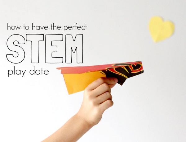 Child holding paper airplane aloft with text overlay: how to have the perfect STEM play date.