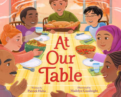 At Our Table picture book cover with illustration of diverse family at dining table. 