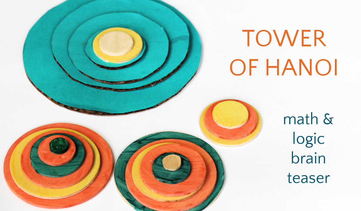 Four piles of concentric circles made from blue, orange and yellow cardboard for tower of Hanoi puzzler game.